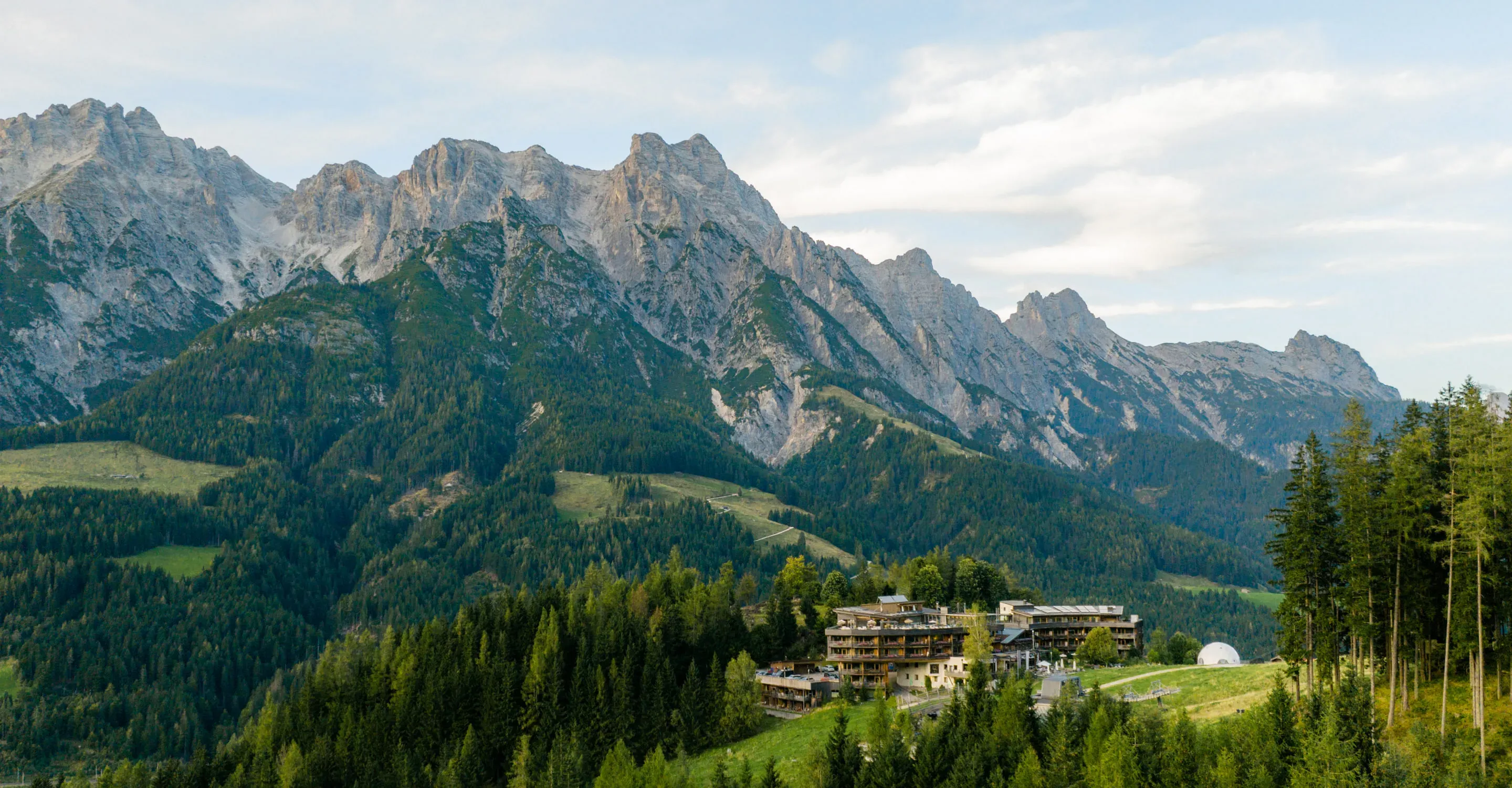 Mountain landscape with extensive forest and accommodation