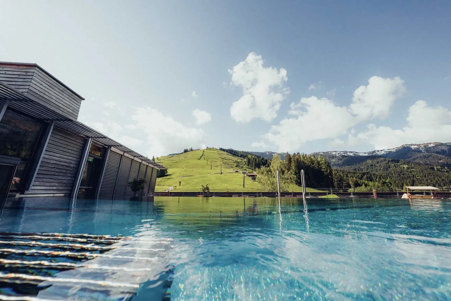 Rooftop pool against a mountain backdrop