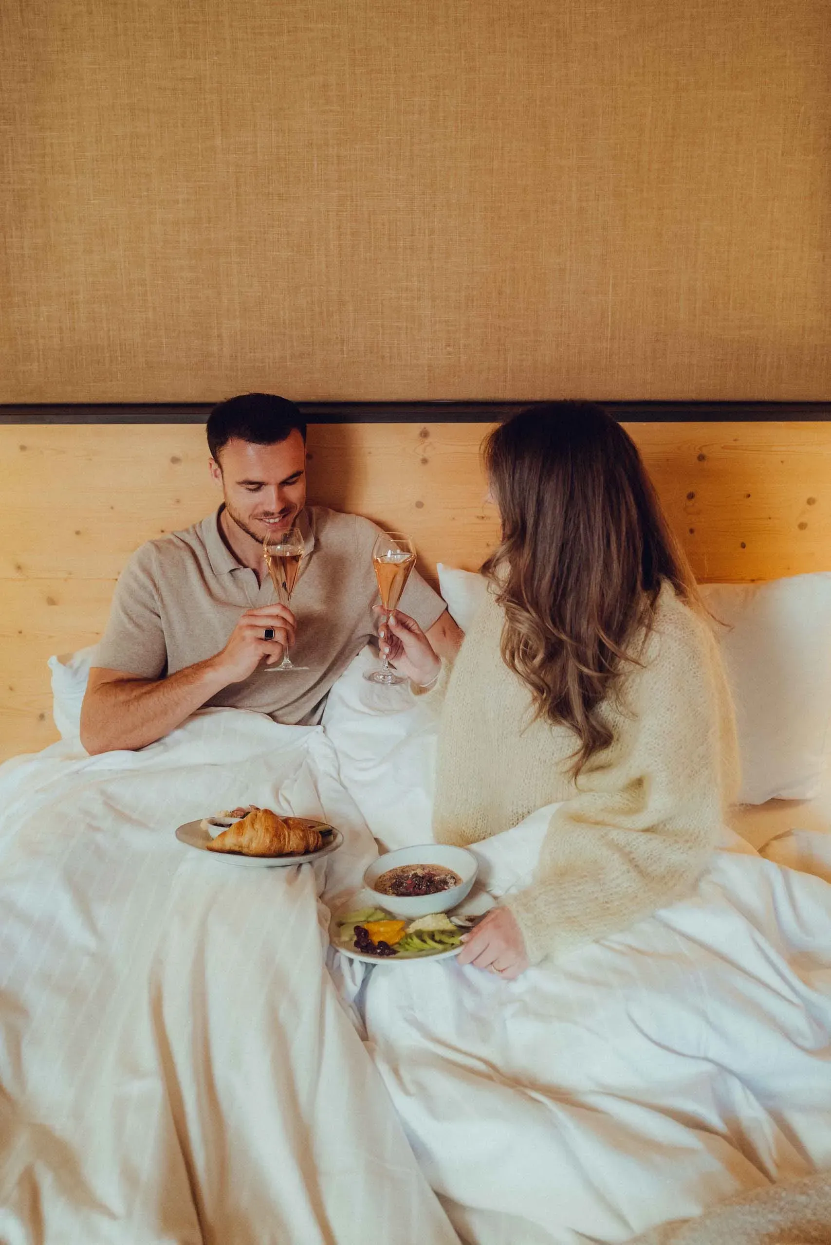 Couple in love enjoying breakfast in bed