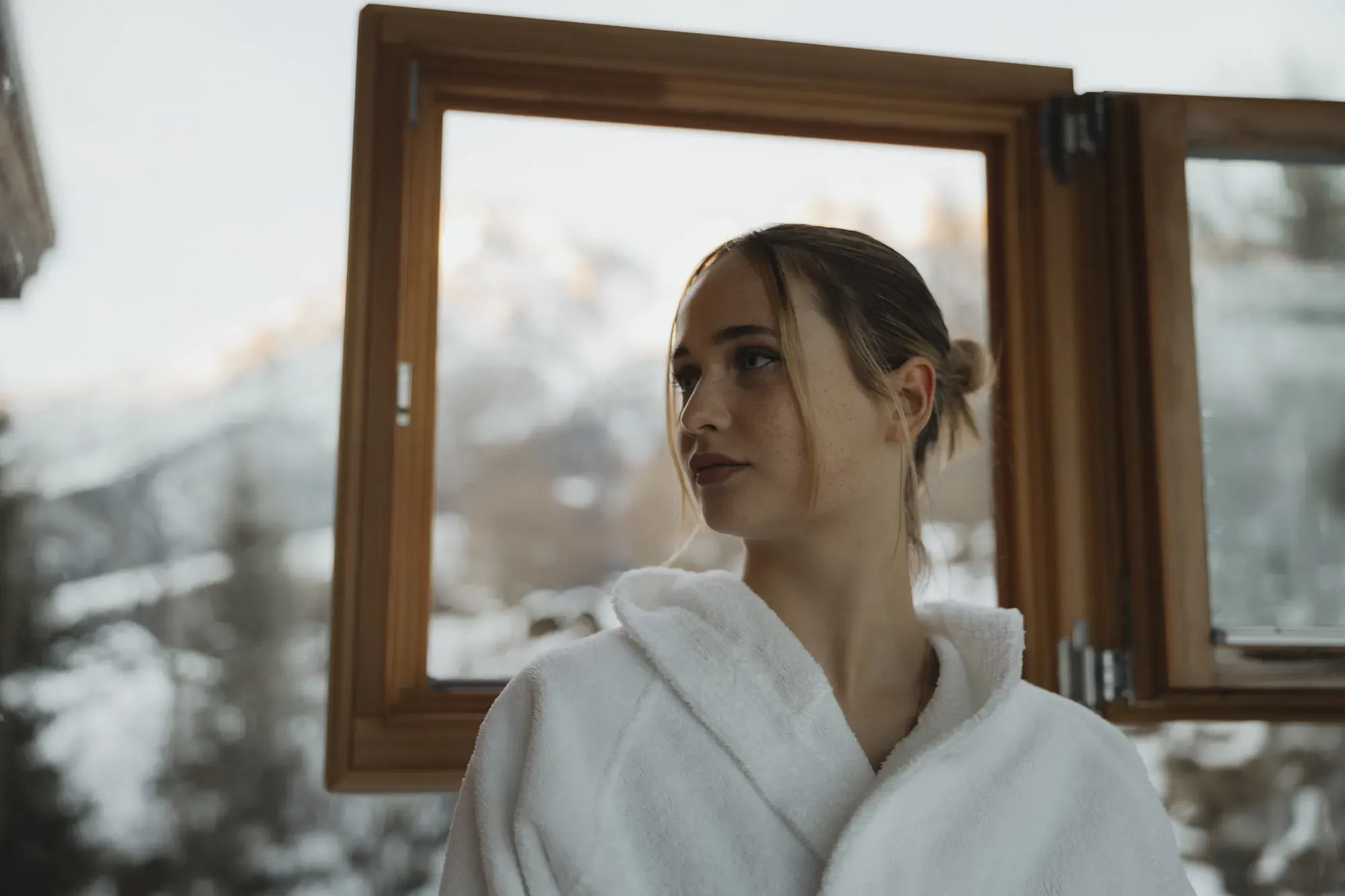 Woman in a bathrobe in the spa area